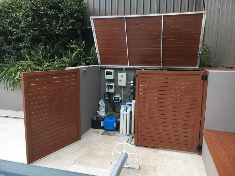 Hidden Wooden Doors Concealing Pool Heater System