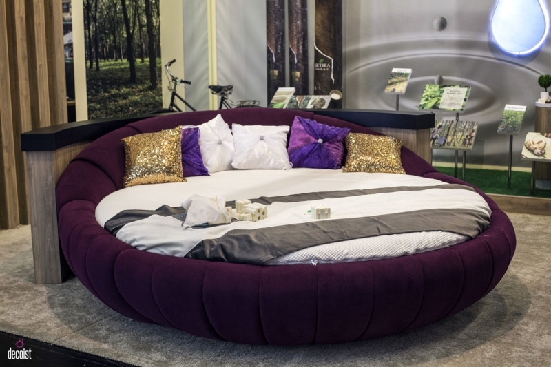 Luxurious Round Purple Bed with Colorful Pillows