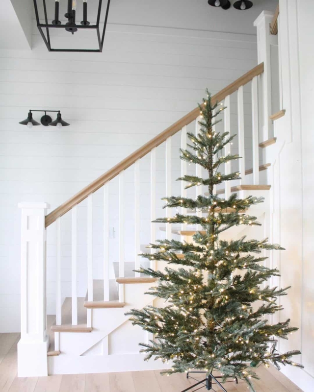 Minimalist Christmas Tree with Warm White Lights on Staircase