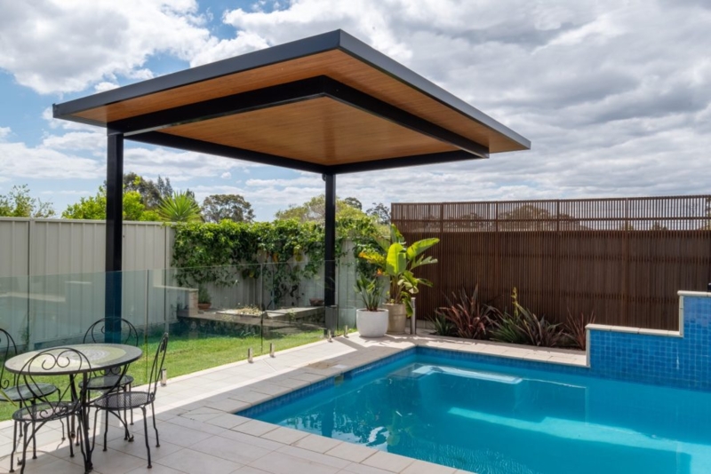 Modern Cantilever Pergola by Poolside with Seating