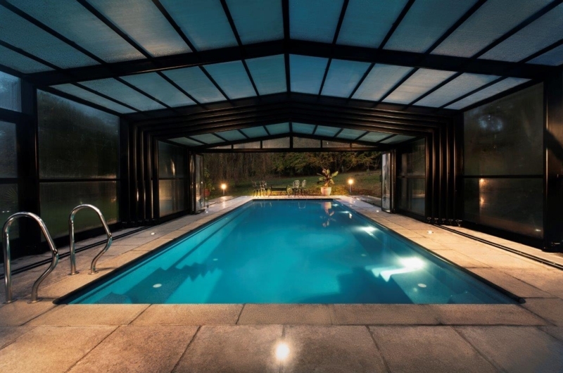 Modern Glass-Enclosed Indoor Swimming Pool Design