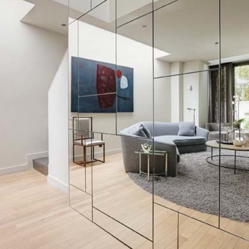 Modern Living Room with Mirrored Wall Panels