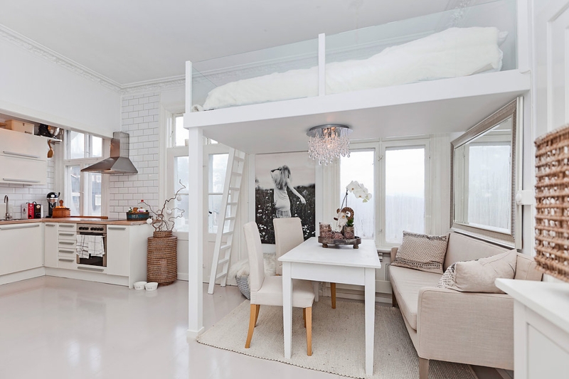 Modern Loft Bed with Glass Railings and Open Kitchen
