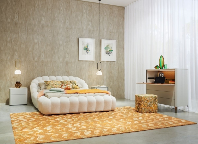 Modern Plush White Bed with Patterned Orange Rug