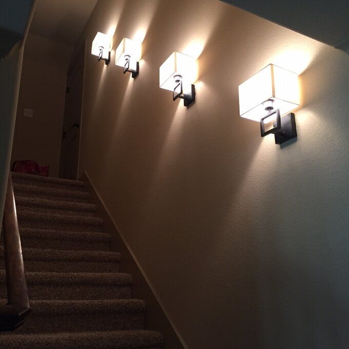 Modern Wall Sconces Illuminating Staircase Design