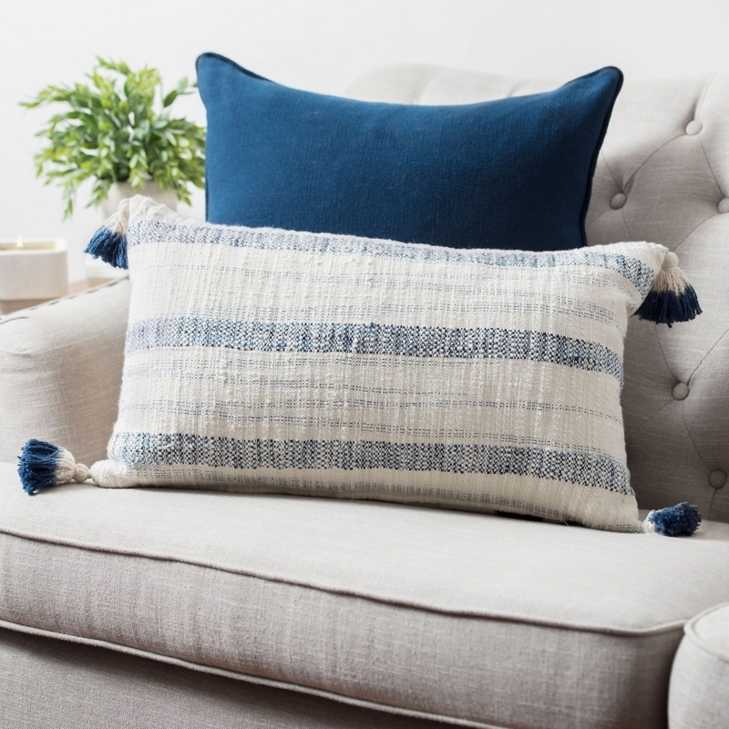 Navy Blue Striped Tassel Cushion on Neutral Sofa