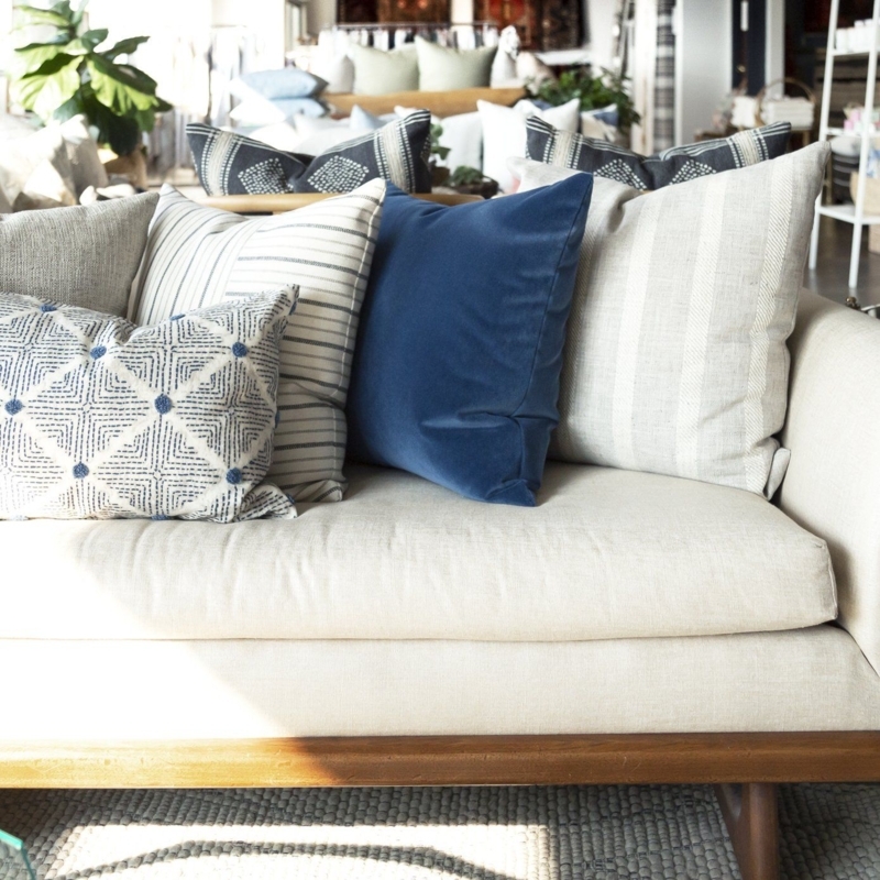 Neutral Sofa with Textured Navy and Patterned Pillows