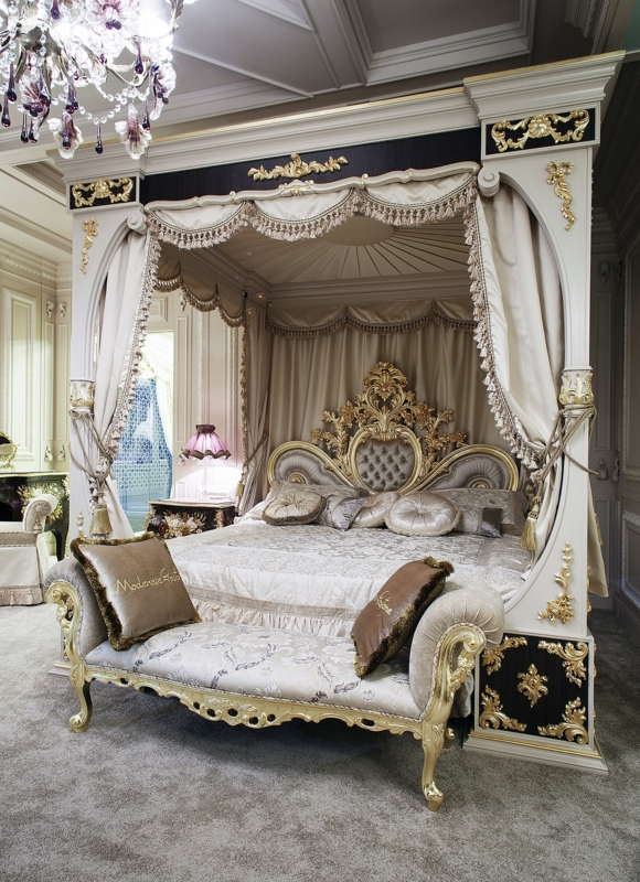 Opulent Four-Poster Bed with Elegant Gold Accents