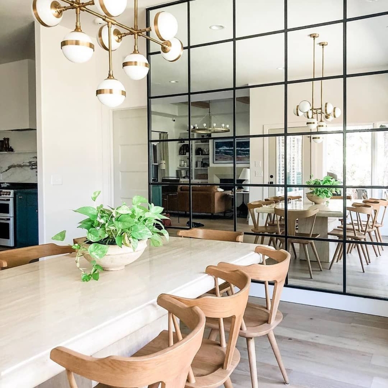 Really loving how the mirror wall in this dining space by ...