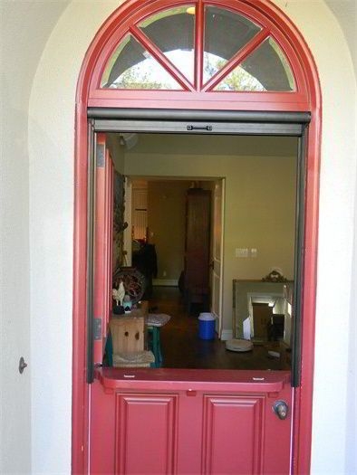 Red Dutch Door with Retractable Screen in Entryway