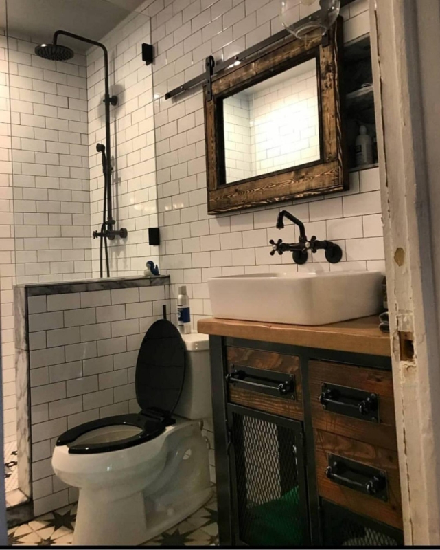 Rustic Industrial Bathroom with Wooden Vanity and Subway Tiles