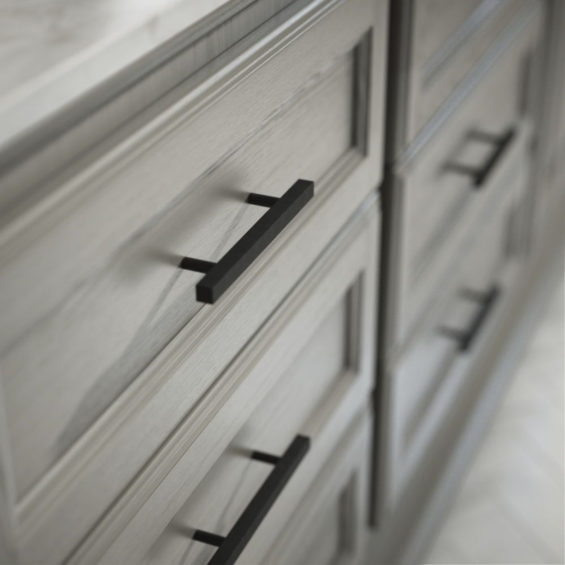 Sleek Black European Cabinet Handles on Wooden Drawers