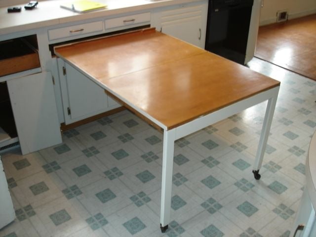 Space-Saving Kitchen Cabinet with Pull-Out Table