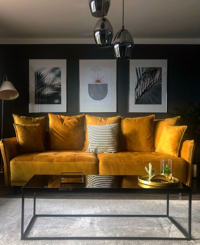 Stylish Living Room with Gold Sofa and Black Accents