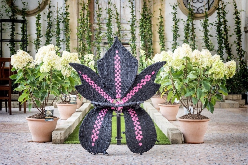 Unique Flower-Shaped Woven Chair in Garden Setting