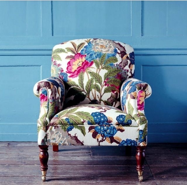 Vibrant Floral Armchair with Blue Accent Wall