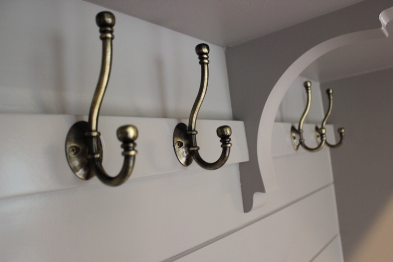 Vintage Brass Mudroom Hooks on White Paneling