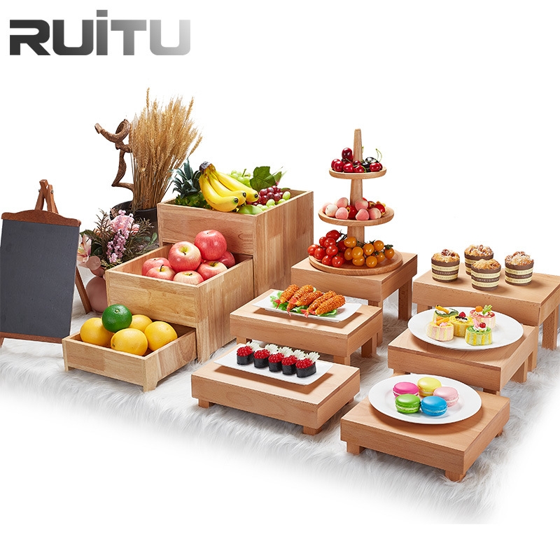 Wooden Buffet Display with Fresh Fruit and Desserts