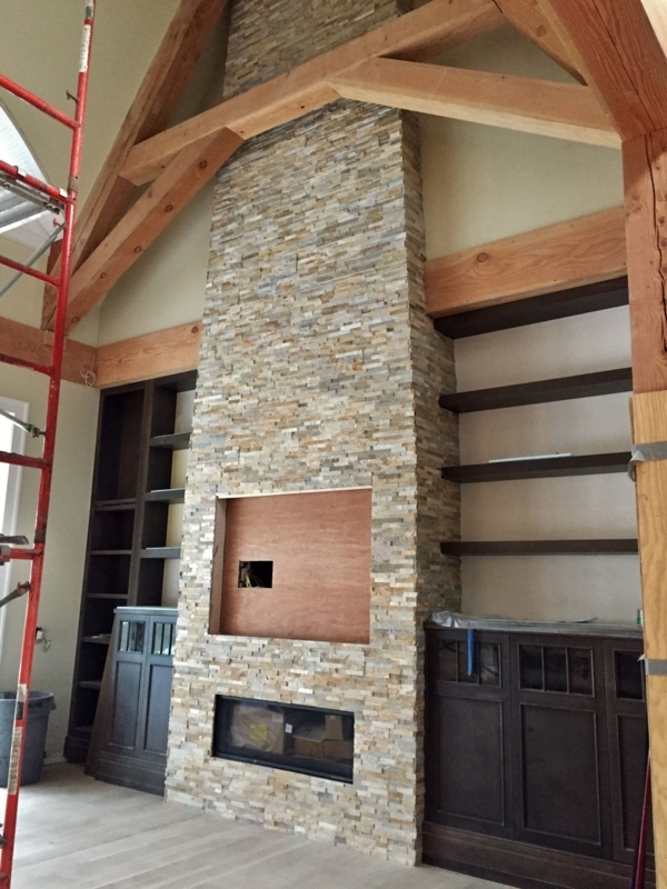 29-Foot Tall Stone Fireplace with Built-In Shelving