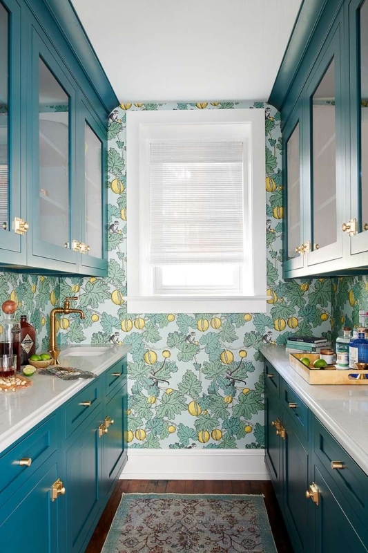 Blue Kitchen Cabinets with Botanical Wallpaper Accent