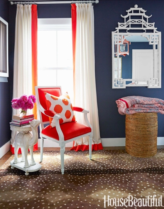 Bold Orange Accent Chair with Patterned Rug