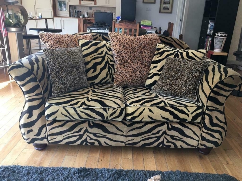 Bold Zebra Print Sofa with Mixed Animal Cushions
