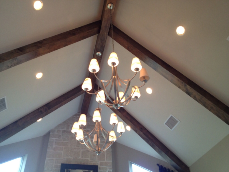 Chic Chandeliers on Elegant Vaulted Ceiling Beams