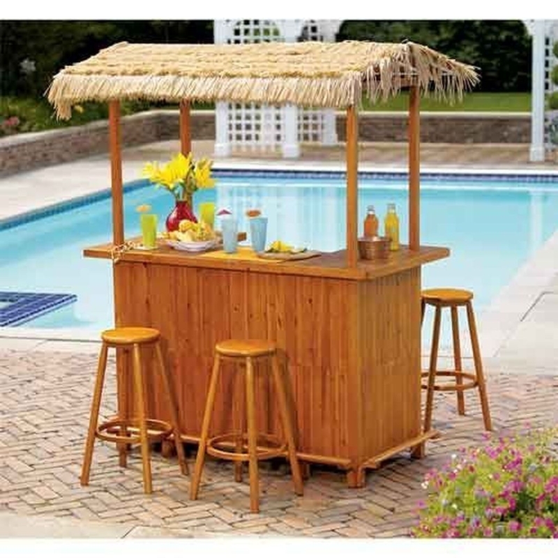 Chic Outdoor Tiki Bar with Palm Leaf Canopy