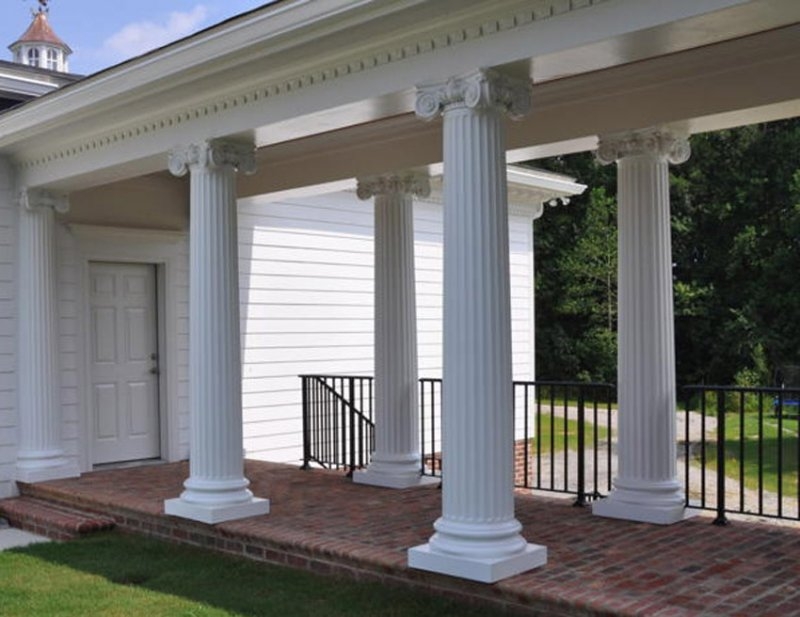 Classic White Decorative Columns on Brick Porch