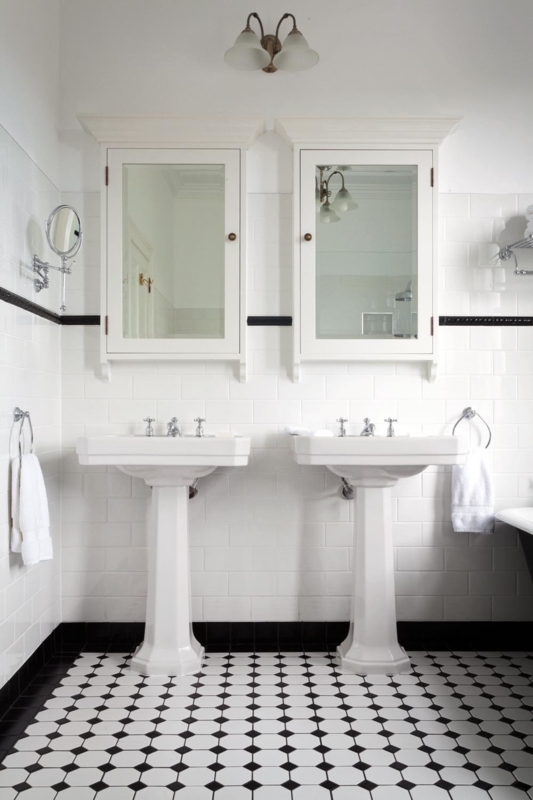 Classic White Double Sink Bathroom with Black Accents