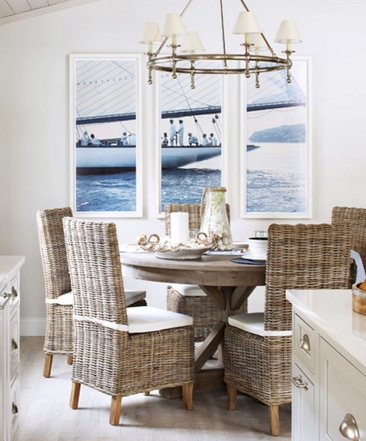 Coastal Dining Room with Rattan Wicker Chairs and Nautical Art