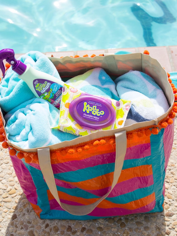 Colorful Pool Bag Filled With Towels and Essentials