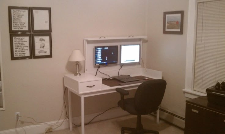 Compact Hidden Desk with Dual Monitors and Storage