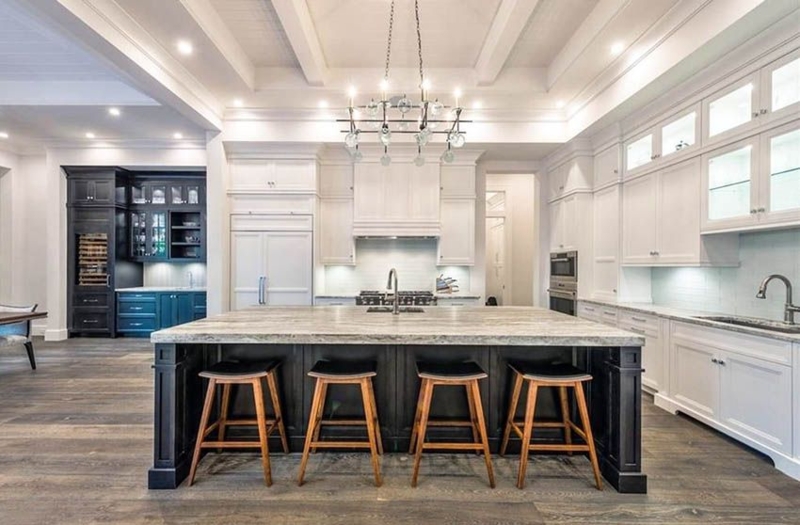Contrasting kitchen island with black base cabinet and white main ...