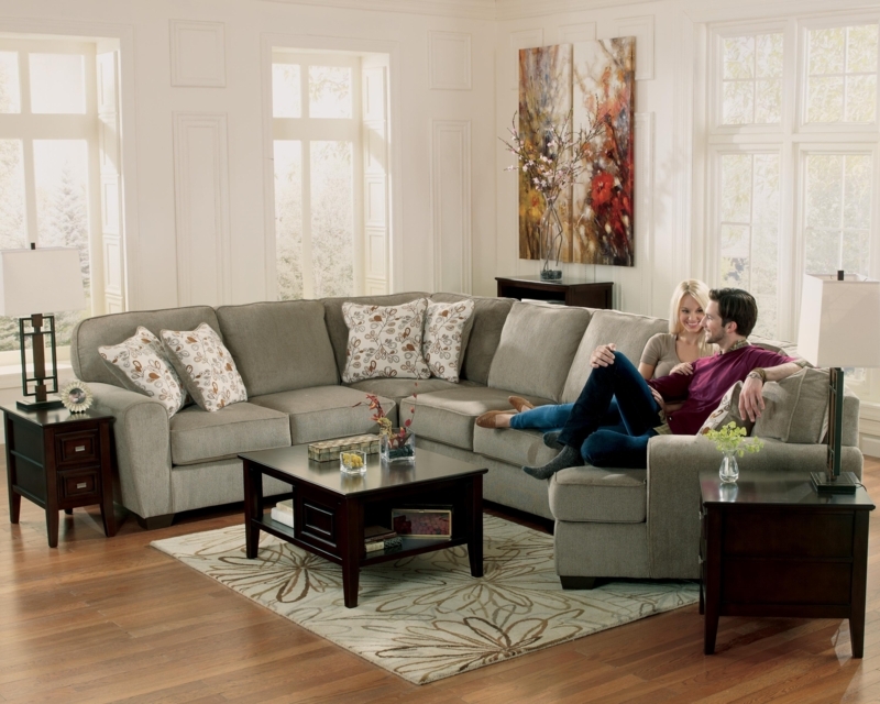 Cozy Gray Sectional Sofa with Floral Accent Pillows