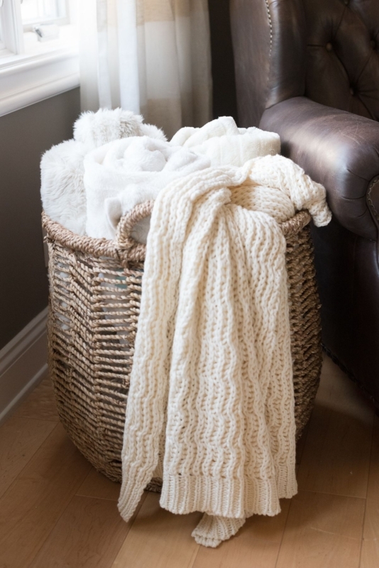 Cozy Knitted Throws in Woven Basket Decor