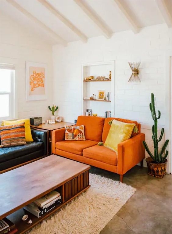 Cozy Living Room with Orange Sofa and Neutral Carpet