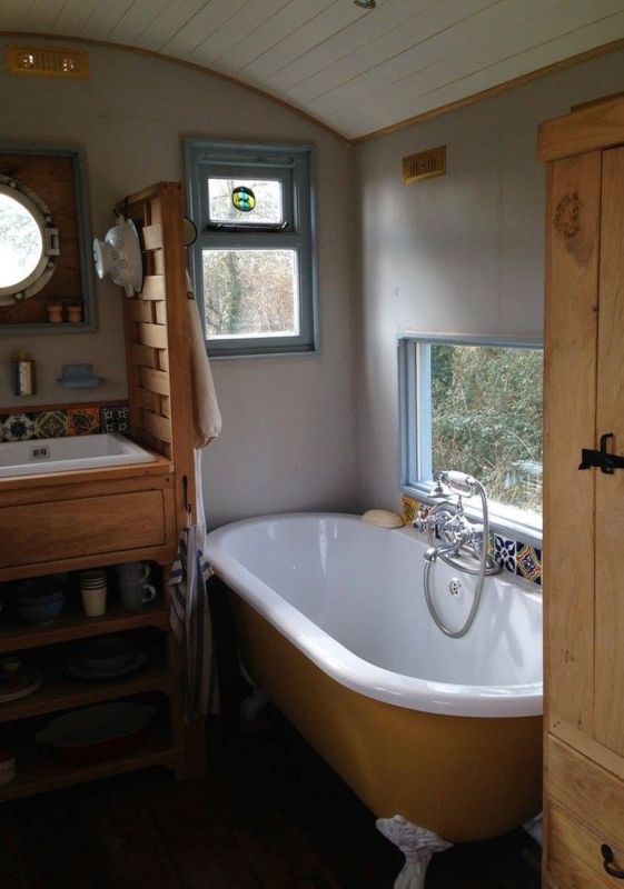 Cozy Rustic Tiny House Bathroom with Clawfoot Tub