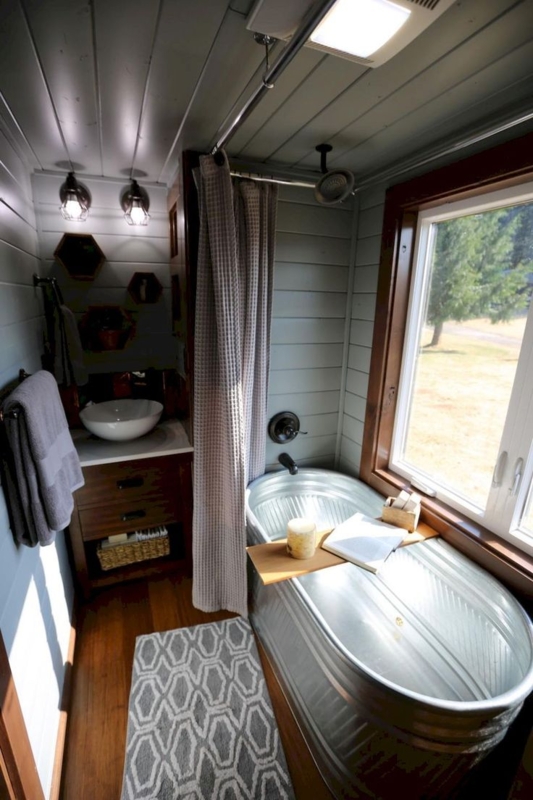 Cozy Rustic Tiny House Bathroom with Tub and Shower