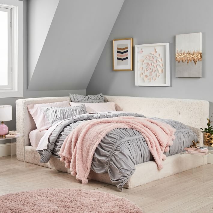 Cozy Upholstered Corner Bed with Soft Pastels