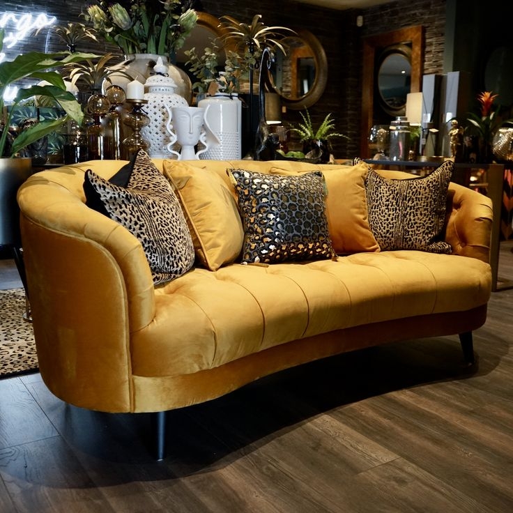 Curved Gold Velvet Sofa with Leopard Print Cushions