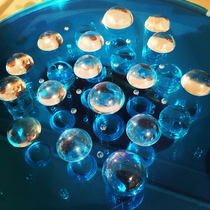 Decorative Glass Bubbles on Blue Convex Mirror