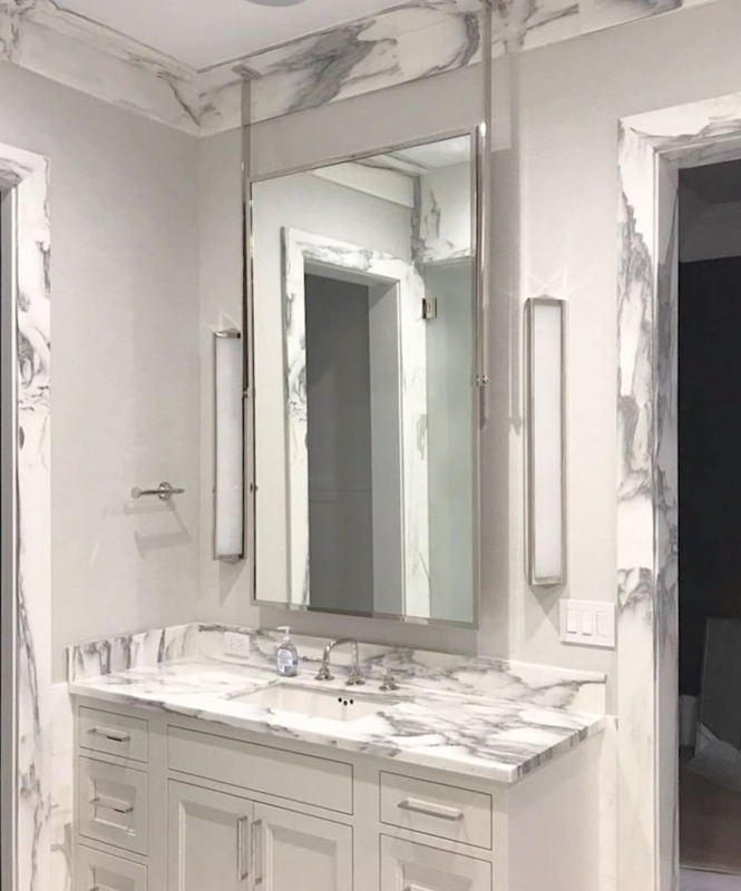 Elegant Bathroom with Ceiling Mounted Mirror and Marble
