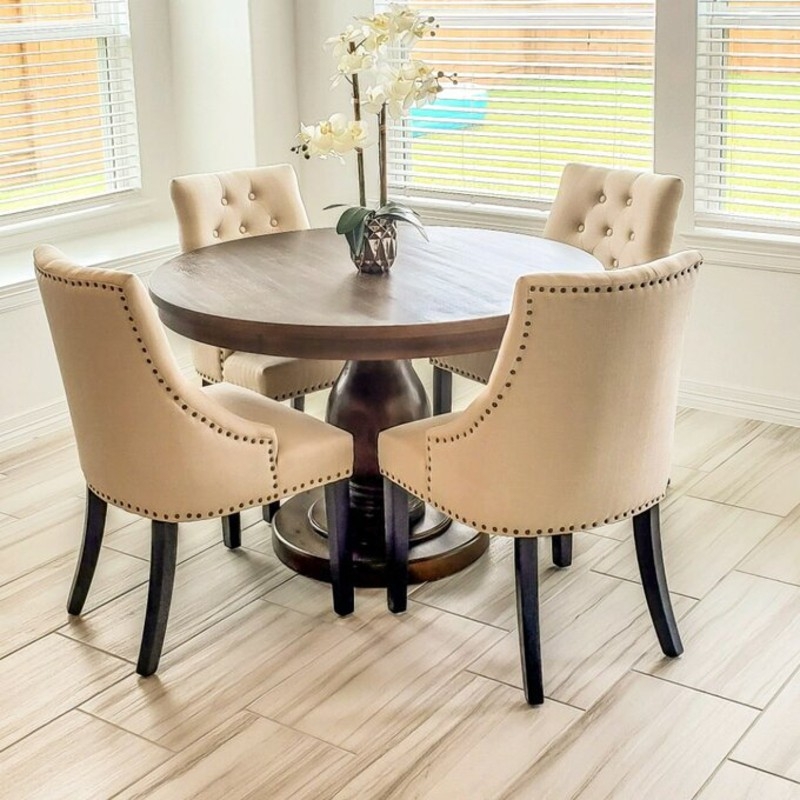 Elegant Beige Captains Chairs with Round Wood Table