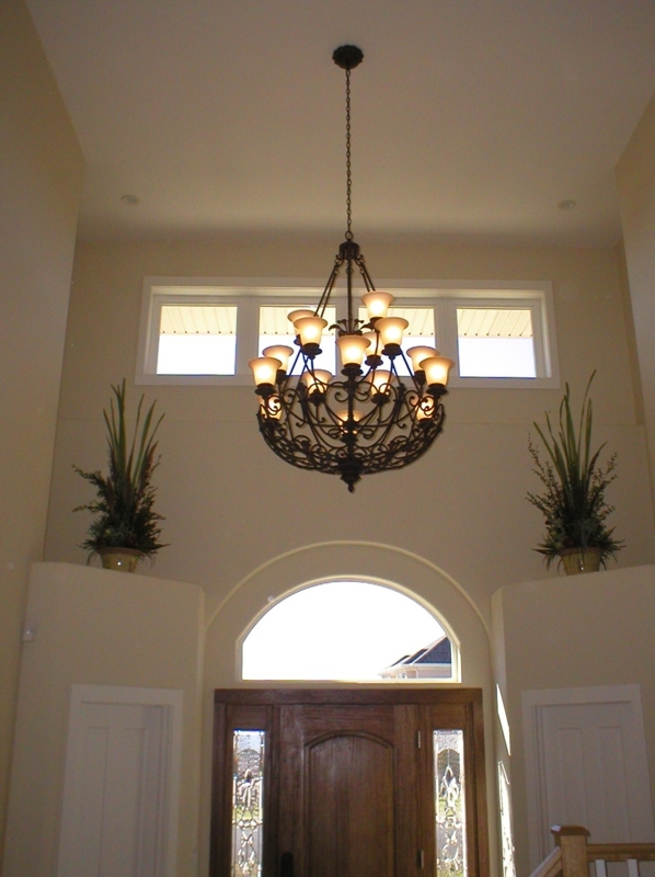 Elegant Chandelier Hanging from Vaulted Ceiling