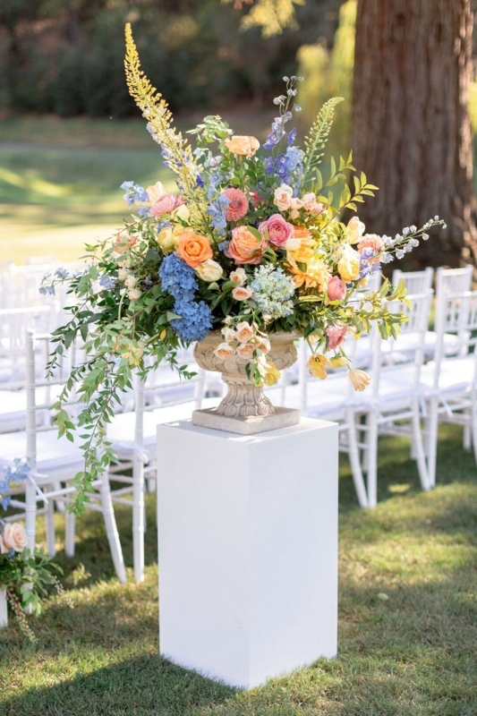 Elegant Colorful Floral Arrangement on White Pedestal
