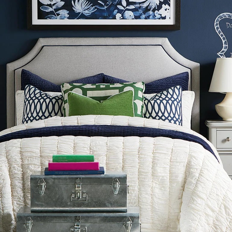 Elegant Custom Upholstered Bed with Patterned Pillows