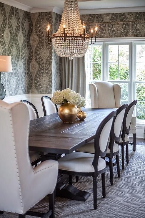 Elegant Dining Room with Captain Chairs and Chandelier