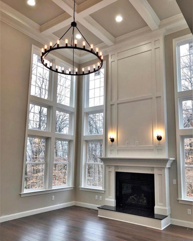Elegant High Ceiling Fireplace Remodel with Large Windows
