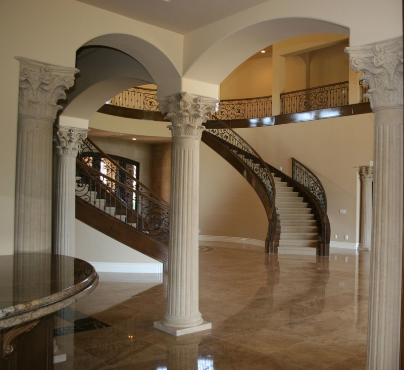 Elegant Interior Columns with Curved Staircase Design